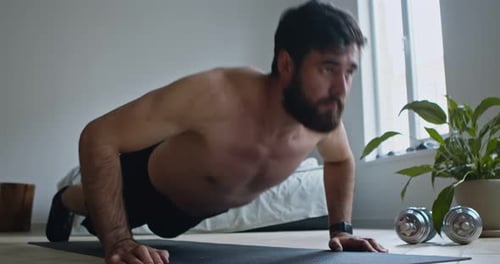 Shirtless Guy Exercising Push Ups on Floor at Home, Close Up