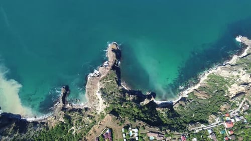 Aerial View From Above on Calm Azure Sea and Volcanic Rocky Shores