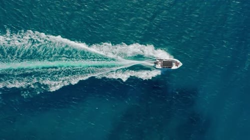 Speedboat Cruising on Turquoise Ocean Waters