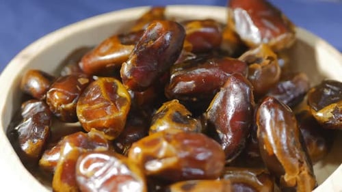 Fresh Medjool Dates in a Wooden Bowl