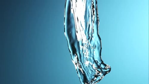 Water Flowing Abstractly Against Blue Background