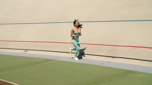 Sexy Woman Training on Athletics Track at Stadium. Athlete Woman Sprinting