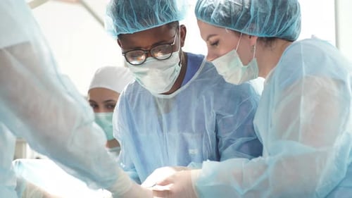 Experienced African Doctor and His Team Perform the Surgery