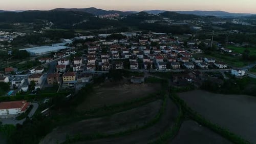 Aerial View of Residential Houses in Suburban Rural Area at Sunset