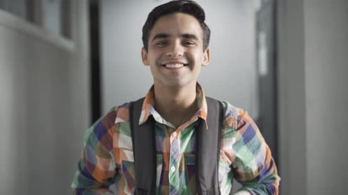 Portrait of Positive Confident Handsome High School Student Looking at Camera and Smiling