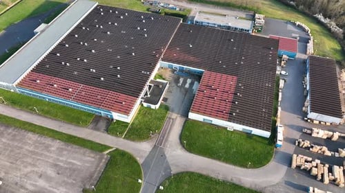 Aerial View of Goods Warehouses and Logistics Center in Industrial City Zone From Above