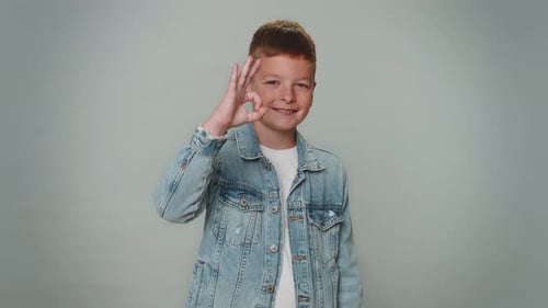 Smiling Boy Giving OK Hand Gesture
