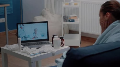 Woman Consults Doctor Online From Home