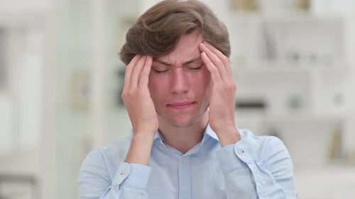Tired Casual Young Man Having Headache