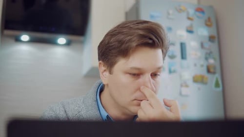 Adult Blowing Nose With Tissue Indoor Close Up