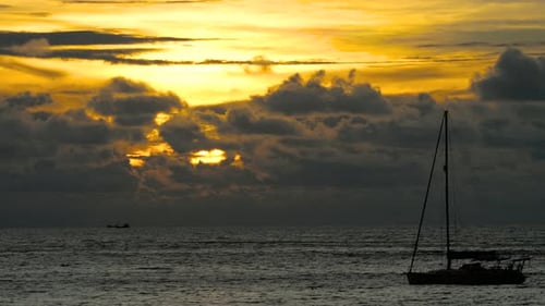 Yacht in the Tropical Sea at Dramatic Sunset