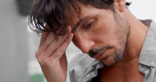 Tense man touching his forehead 4k