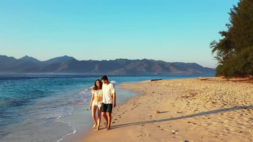 Beautiful man and woman married on vacation enjoy luxury on beach on white sand background 4K