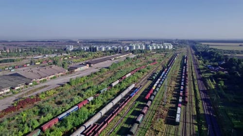 Aerial View of Freight Train Yard on Sunny Day