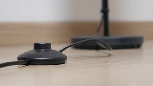 Lamp foot switching on and off close-up on button 4K 2160p 30fps UHD footage - Steping on Button On