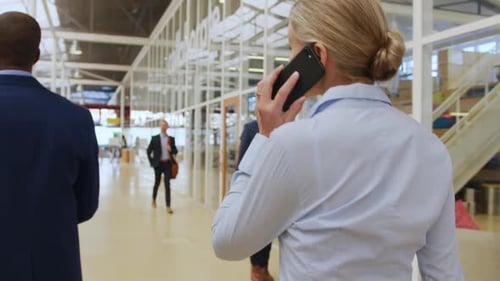 Businesswoman Talking on Phone in Modern Office
