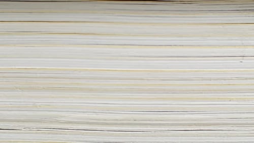 Slider-video view of the book from the side. The book is close-up.