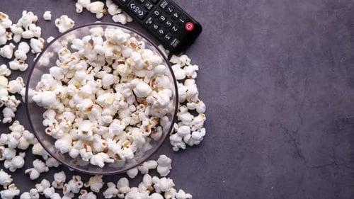 High Angle View of Popcorn and Tv Remote on Table