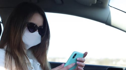 Girl Wearing a Mask During the COVID19 Coronavirus Epidemic a Brunette