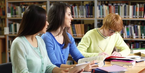 Focused Students Studying Together in a Library