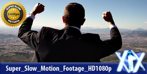 Successful Businessman Celebrating on Mountain Overlooking City