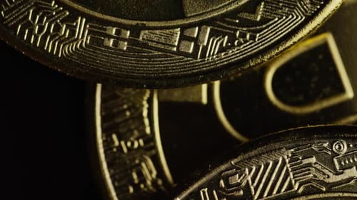 Rotating shot of Bitcoins (digital cryptocurrency) - BITCOIN