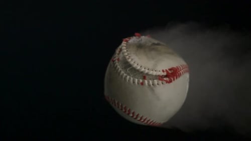 Baseball Flying Through the Air with Smoke