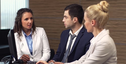 Team Working Together on Computer in Modern Office