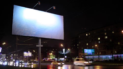 Blank Billboard Advertisement at Night in City