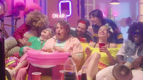 Friends Enjoying Popcorn, Laughter in Apartment