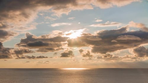 of Evening Sky with Sky Rays and Clouds Crossing Over the Sea Horizon Idyllic Landscape