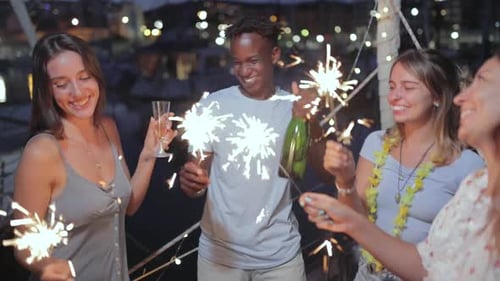 Multiracial Friends Celebrating Together on a Boat in Summer Party at Night