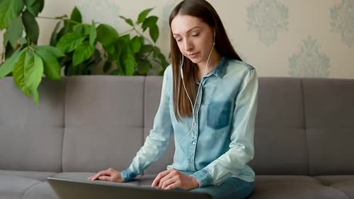 Smiling Woman Using Laptop for Video Call