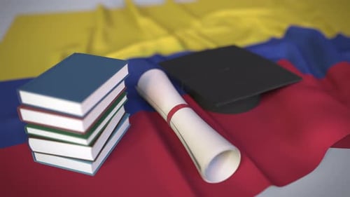 Graduation Cap, Diploma, Books on Waving Colombian Flag