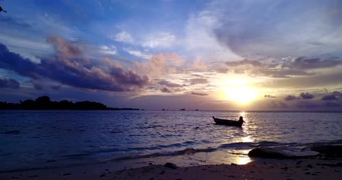 Wide fly over island view of a summer white paradise sand beach and blue ocean background in high re