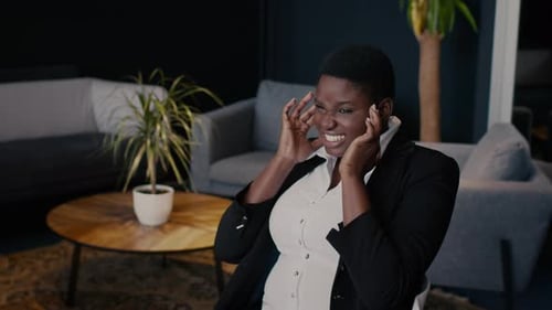 Stressed Woman Holding Face in Office