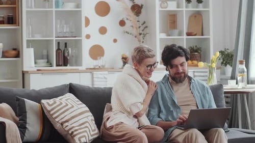 Couple Shops Online with Credit Card at Home