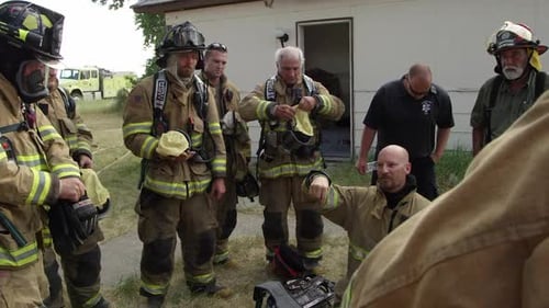 Fire Fighters Gathering for Instructions and Planning