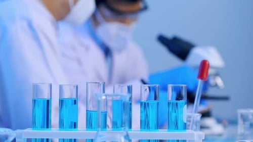 Scientists Working with Microscope and Test Tubes