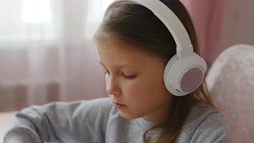 Schoolgirl Girl Studies Online On Laptop At Home