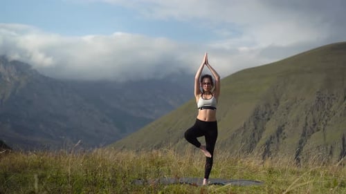 Woman Doing Yoga in Mountainous Area