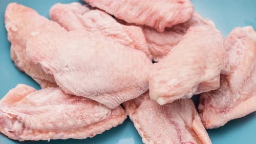 Timelapse process of unfreezing of chicken wings
