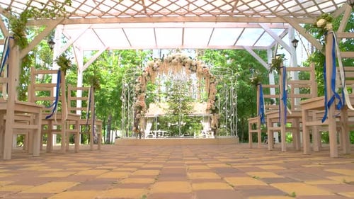 Wedding Venue Setup with Flowers and Chairs