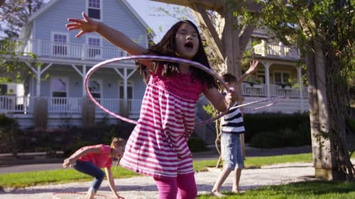 Girls playing with hula hoops at park