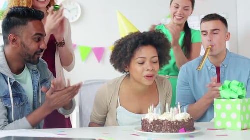 Team Greeting Colleague at Office Birthday Party
