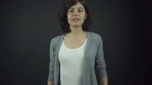 Smiling Young Woman Looking Directly at Camera