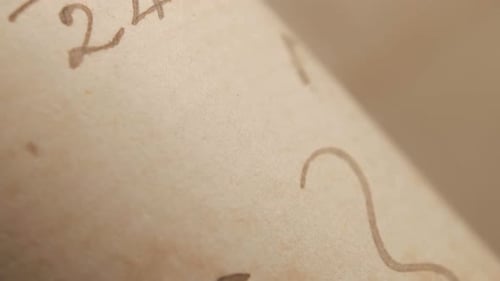 Macro Shot of Old Parchment with Math Equations