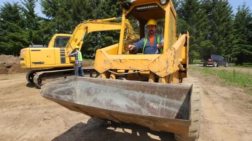 Yellow Loader Idling on Construction Site