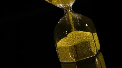 Golden Sand Flowing Through an Hourglass