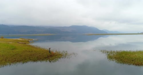 Scenic Lake Landscape with person and animal
